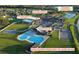 Aerial shot featuring the community pool, APV Fitness Center and Gymnasium, along with the surrounding playground at 2305 Rio Grande Forest Ln, Kissimmee, FL 34759