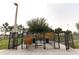 Welcoming entrance to the dog park with clearly posted rules and access to a pet drinking station at 2305 Rio Grande Forest Ln, Kissimmee, FL 34759