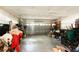 Spacious garage with a roll-up door and lots of storage space for cars and equipment at 2305 Rio Grande Forest Ln, Kissimmee, FL 34759