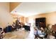 Bright living room featuring tiled floor, neutral wall paint, and open layout adjacent to arched entrance at 2305 Rio Grande Forest Ln, Kissimmee, FL 34759