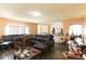 Spacious living room area featuring wood floors, and lots of natural light at 2305 Rio Grande Forest Ln, Kissimmee, FL 34759