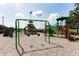 Large community playground with swings, slides, and climbing structures at 2305 Rio Grande Forest Ln, Kissimmee, FL 34759