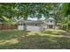 Spacious backyard featuring lush greenery and a fenced perimeter, ideal for outdoor activities and privacy at 240 Cambridge Blvd, Winter Park, FL 32789