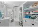 Bathroom featuring a tub with shower, and built-in shelving for storage at 240 Cambridge Blvd, Winter Park, FL 32789