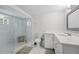 Bathroom with a glass shower, white marble walls, and a modern vanity at 240 Cambridge Blvd, Winter Park, FL 32789