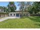 Charming single-story home with a well-maintained lawn, beautiful pavers, and a striking blue double-door entrance at 240 Cambridge Blvd, Winter Park, FL 32789