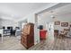 Spacious living area showcasing an open floor plan with stylish hardwood floors and views into other rooms at 240 Cambridge Blvd, Winter Park, FL 32789