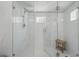 Bright shower featuring marble walls, glass enclosure, and a rainfall showerhead at 240 Cambridge Blvd, Winter Park, FL 32789