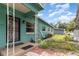 Inviting front entrance of a single-story home with a tidy landscaped yard at 240 W Grossenbacher Dr, Apopka, FL 32712