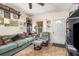Comfortable living room featuring tile floors, seating area, and a ceiling fan at 240 W Grossenbacher Dr, Apopka, FL 32712