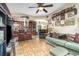 Open-concept living room and kitchen with tile floors and ceiling fan at 240 W Grossenbacher Dr, Apopka, FL 32712