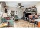 Bright living room featuring tile floors, a ceiling fan, and a comfortable seating area at 240 W Grossenbacher Dr, Apopka, FL 32712