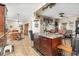 Open-concept space with a kitchen island seamlessly connecting to the dining and living areas, perfect for entertaining at 240 W Grossenbacher Dr, Apopka, FL 32712