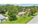 Overhead view highlighting the property's expansive green lawn, mature trees, and proximity to neighborhood amenities at 2704 Yule Tree Dr, Edgewater, FL 32141