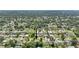 Wide aerial shot of a home in a community filled with lush greenery and neatly arranged houses at 2704 Yule Tree Dr, Edgewater, FL 32141