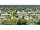 Aerial view of home in a peaceful neighborhood featuring mature trees and well-maintained lawns at 2704 Yule Tree Dr, Edgewater, FL 32141