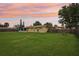 Expansive backyard featuring a large, well-maintained lawn and a wooden fence at 2704 Yule Tree Dr, Edgewater, FL 32141