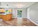 Open dining area with new floors and natural light at 2704 Yule Tree Dr, Edgewater, FL 32141