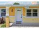 Close-up of front entrance featuring a white door and decorative lighting at 2704 Yule Tree Dr, Edgewater, FL 32141