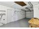 A spacious garage with an automatic garage door opener and a workbench at 2704 Yule Tree Dr, Edgewater, FL 32141