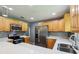 Beautiful kitchen features stainless steel appliances, quartz countertops, and wood cabinets at 2704 Yule Tree Dr, Edgewater, FL 32141
