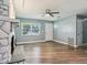 Spacious living room with a fireplace and updated flooring at 2704 Yule Tree Dr, Edgewater, FL 32141