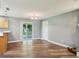 A spacious living room featuring new wood floors and sliding glass doors to the back porch at 2704 Yule Tree Dr, Edgewater, FL 32141