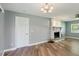 Cozy living room boasting updated flooring and a charming fireplace at 2704 Yule Tree Dr, Edgewater, FL 32141