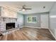 Bright living room featuring new floors, a fireplace, and natural light at 2704 Yule Tree Dr, Edgewater, FL 32141