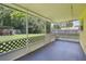 Covered porch with concrete flooring offering views of the backyard at 2704 Yule Tree Dr, Edgewater, FL 32141
