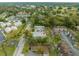 Birds eye view showcases the property within a community surrounded by trees at 2826 Ne 7Th St, Ocala, FL 34470