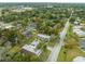 Aerial shot features the property's setting surrounded by trees and residential neighborhood at 2826 Ne 7Th St, Ocala, FL 34470
