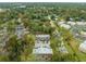 Drone shot highlights the property's location surrounded by lush trees and community at 2826 Ne 7Th St, Ocala, FL 34470