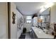A practical bathroom with a modern vanity, fixtures, and a decorative shower curtain at 2826 Ne 7Th St, Ocala, FL 34470