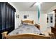 A nicely decorated bedroom featuring a wooden bed frame and access to an ensuite bath at 2826 Ne 7Th St, Ocala, FL 34470