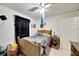 Comfortable bedroom with a ceiling fan, ample lighting, and neutral decor at 2826 Ne 7Th St, Ocala, FL 34470