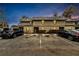 Two-story condo building with dedicated parking spaces and simple landscaping at 2826 Ne 7Th St, Ocala, FL 34470