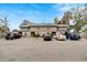 Exterior shot of property, featuring ample parking spaces and well-kept landscaping at 2826 Ne 7Th St, Ocala, FL 34470