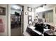 A small hallway with a closet and an entrance into another room with a walk-in closet at 2826 Ne 7Th St, Ocala, FL 34470