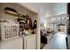 Convenient laundry area with a washer and dryer, shelving, and a view of the living room at 2826 Ne 7Th St, Ocala, FL 34470