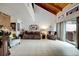 Bright living room with vaulted ceiling, tile floor, sofa, and natural light at 2826 Ne 7Th St, Ocala, FL 34470