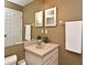 Bathroom featuring a single vanity, large framed mirror, and adjacent toilet at 2928 Lake Pineloch Blvd # Ge, Orlando, FL 32806