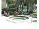 Inviting hot tub surrounded by lush greenery and a serene atmosphere to relax outdoors at 2928 Lake Pineloch Blvd # Ge, Orlando, FL 32806