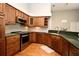 Spacious kitchen with wooden cabinets, stainless steel appliances, and a clean, updated design at 2928 Lake Pineloch Blvd # Ge, Orlando, FL 32806
