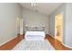 The main bedroom features an ensuite bathroom, closet, ceiling fan, and hardwood floors at 2928 Lake Pineloch Blvd # Ge, Orlando, FL 32806