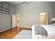 Main bedroom offers multiple entryways, hardwood floors, and a ceiling fan at 2928 Lake Pineloch Blvd # Ge, Orlando, FL 32806