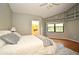 The main bedroom offers built-in shelving, hardwood floors, and ample natural light at 2928 Lake Pineloch Blvd # Ge, Orlando, FL 32806
