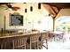 Pool house including a bar area with chairs, table seating, and pool rules at 2928 Lake Pineloch Blvd # Ge, Orlando, FL 32806