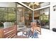 Relaxing screened in porch with tile floor, ceiling fan, and comfortable chairs overlooking the backyard at 2928 Lake Pineloch Blvd # Ge, Orlando, FL 32806