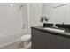 Clean bathroom features a white tiled shower, a modern vanity, and stylish fixtures at 3301 Tranquil Trl, Kissimmee, FL 34747